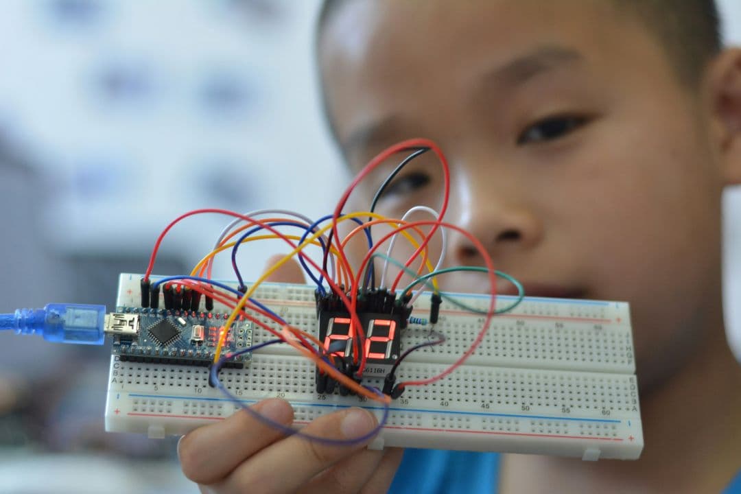 a kid showing a led display circuit